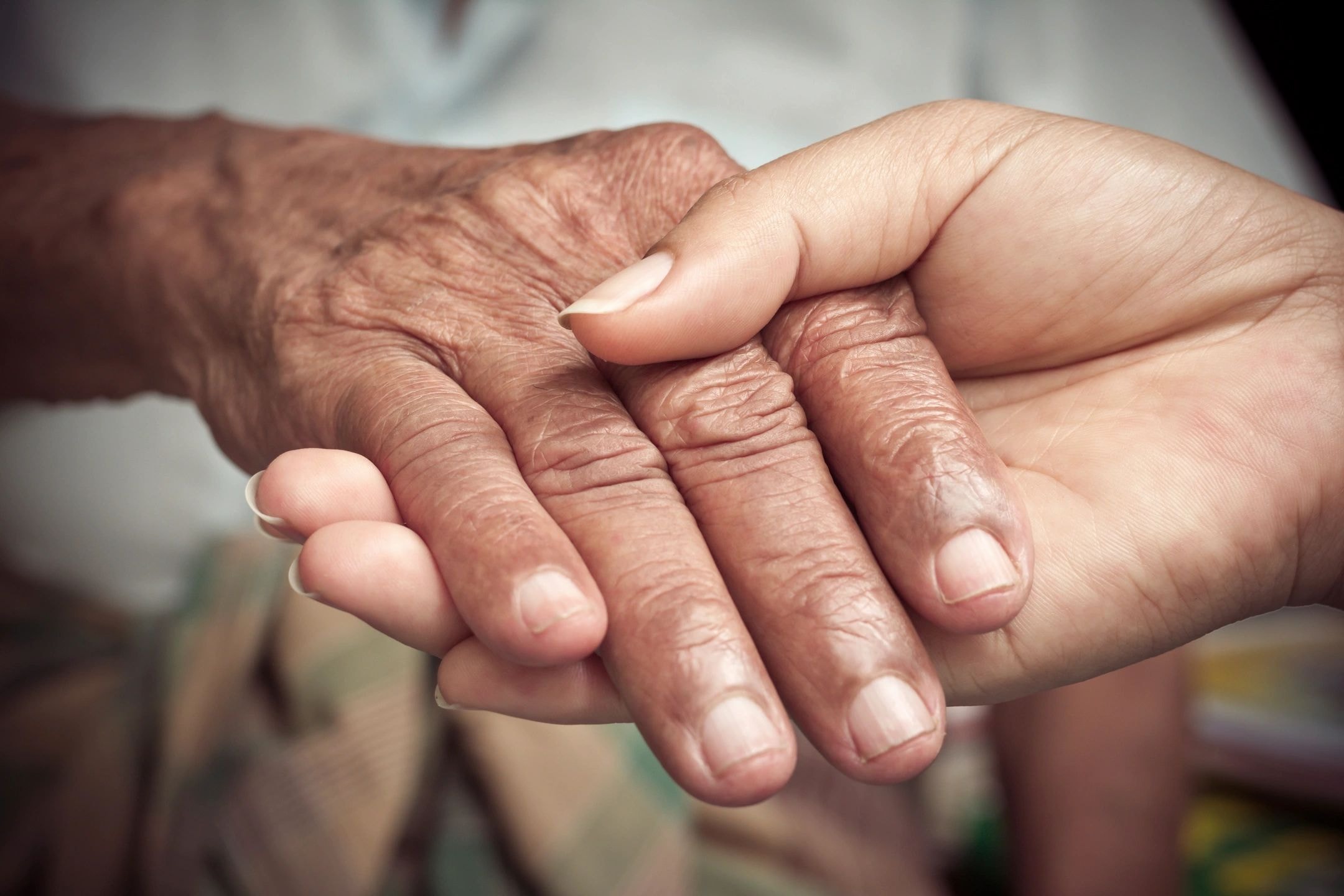 Caregiver assisting a person with physical disability support